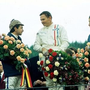 Formula One World Championship: The podium finishers 2nd Pedro Rodriguez BRM, 1st Bruce McLaren McLaren, 3rd Jacky Ickx Ferrari