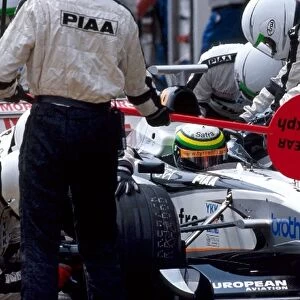 Formula One World Championship: Race retiree Ricardo Rosset Tyrrell 026 makes a pit stop