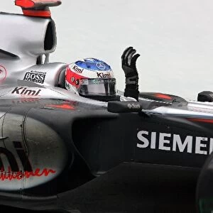 Formula One World Championship: Race winner Kimi Raikkonen McLaren Mercedes MP4 / 20 waves to the crowd