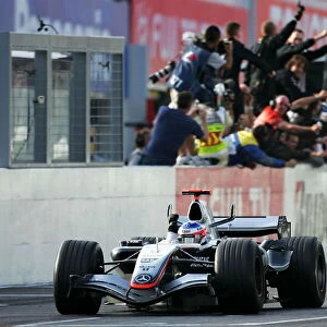 Formula One World Championship: Race winner Kimi Raikkonen McLaren Mercedes MP4 / 20 celebrates at the end of the race
