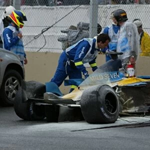 Formula One World Championship: The remains of the Renault R23 of Fernando Alonso after his race ending crash