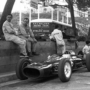 Formula One World Championship: Roy Salvadori with his team mate John Surtees wait patiently for action alongside their Lola Mk4├òs during practice