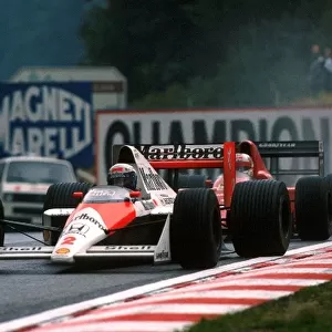 Formula One World Championship: Second place finisher Alain Prost McLaren MP4 / 5 leads third place finisher Nigel Mansell Ferrari 640