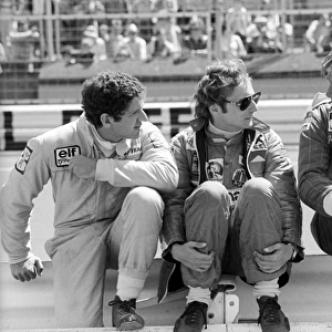 Formula One World Championship: Second placed Jody Scheckter Tyrrell talks with Niki Lauda Ferrari, who suffered a life-threatening accident in the race