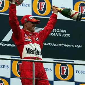 Formula One World Championship: Second placed Michael Schumacher Ferrari celebrates his seventh World Championship on the podium