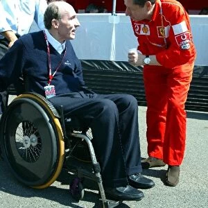 Formula One World Championship: Sir Frank Williams Williams Team Owner talks with Jean Todt Ferrari Team Sporting Director