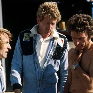 Formula One World Championship: Sixth placed Jacques Laffite Ligier talks with Jean-Pierre Jabouille, who retired from the race in the debut