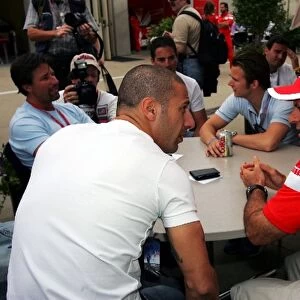 Formula One World Championship: Tony Kanaan talks with Rubens Barrichello Ferrari