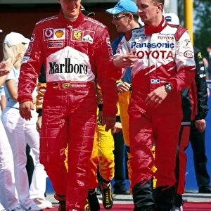 Formula One World Championship: Toyotas Allan McNish, right, chats with F1 World Champion Michael Schumacher Ferrari, left