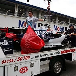 Formula One World Championship: The Williams FW28 of Nico Rosberg Williams returns to the pits on the back of a truck
