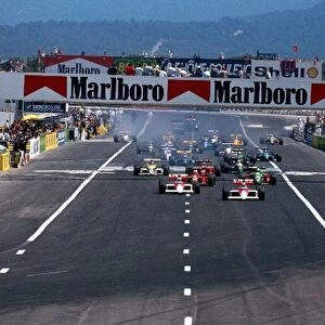 Formula One World Championship: Winner Alain Prost McLaren MP4 / 5 leads the field away at the start