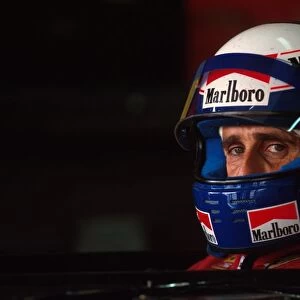 Formula One World Championship: Winner Alain Prost Ferrari 641 sits in his car during qualifying