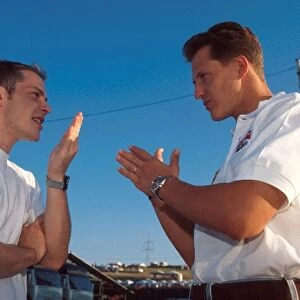 Formula One World Championship: Winner Jacques Villeneuve Williams FW18 with Michael Schumacher, right