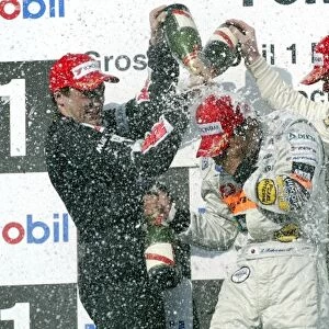 German Formula Three Championship: The podium: Gary Paffett Team Rosberg second; race winner Kousuke Matsuura PREMA Powerteam; Jeffrey van Hooydonk