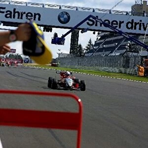 German Formula Three Championship: Race winner Markus Winkelhock crosses the finishing line to the delight of his team