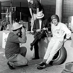 Jabby Crombac in the pit lane with Jim Clark. Portrait. World Copyright: LAT Photographic ref: 35mm Transparency