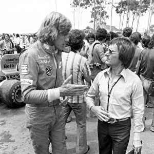 James Hunt (with holes in his boots) talks to Bernie Ecclestone