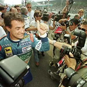 JEAN ALESI GIVES THE THUMBS UP AFTER SECURING POLE POSITION AT THE ITALIAN GP'97. PHOTO:LAT/COATES