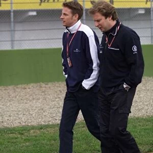 Jensonm Button talks with his race engineer