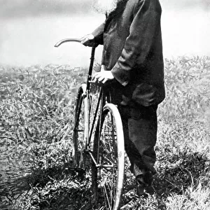John Boyd Dunlop. Portrait with the first pneumatic tyres on a bicycle. World Copyright: LAT Photographic Ref: Black & print
