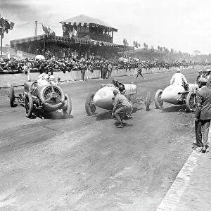Le Mans, France. 26 July 1921: Henry Segrave avoids Jimmy Murphy and Andre Dubonnet in the pits. Murphy finished in 1st position