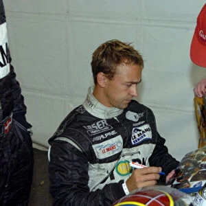 Le Mans Inspection-June 13, 3006-Nicolas Kiesa signs fans pictures. World Copyright-Dave Friedman / LAT Photographic 2006