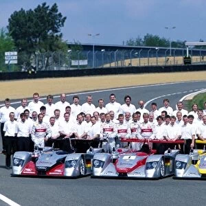 Le Mans Pre-qualifying: The Audi Sport entries pose for a picture including Team personnel, managers, drivers and mechanics