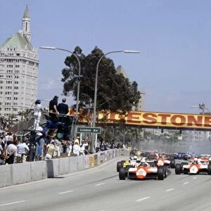 Long Beach, California, USA. 2-4 April 1982: Andrea de Cesaris leads Niki Lauda, Rene Arnoux, Alain Prost and Bruno Giacomelli at the start