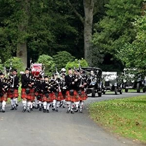 Mount Stuart Classic: The Scottish pipe band lead the Mount Stuart classic car parade