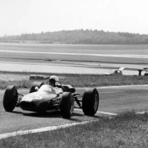 Reims, France. 3 July 1966: Bob Anderson, Brabham BT11-Climax, 7th position, leads Chris Amon, Cooper T81-Maserati, 8th position, action