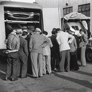 Reims, France. 4 July 1954: The transporters arrive with the cars for Juan Manuel Fangio, Mercedes-Benz W196, 1st position, Hans Herrmann, Mercedes-Benz W196