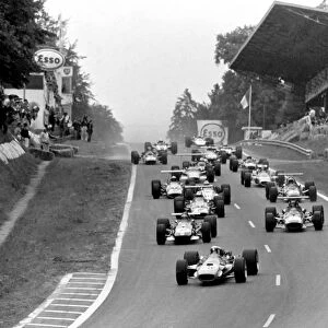Rouen-les-Essarts, France. 7 July 1968: Jackie Stewart leads Jochen Rindt, Jacky Ickx, Denny Hulme, Chris Amon, John Surtees and Bruce McLaren at the start