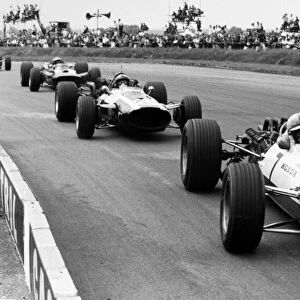 Silverstone, Great Britain. 15 July 1967: John Surtees, Honda RA273, 6th position, leads Pedro Rodriguez, Cooper T81-Maserati, 5th position, action