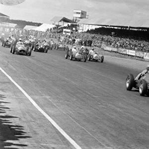 Silverstone, Great Britain. 19 July 1952: Alberto Ascari leads Giuseppe Farina, Reg Parnell, Alan Brown, Ken Downing, Eric Thompson and Mike
