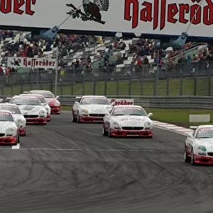 Start of the race, Edi Gay (ITA) / Diego Alessi (ITA), Maserati 3200 GT Coup Cambiocorsa, leading the field into the first corner. Trofeo Maserati, Rd 3, Nrburgring, Germany. 25 May 2003. DIGITAL IMAGE