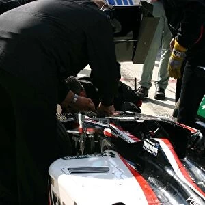 Thunder at the Rock: The Minardi team remove the damaged car of Paul Stoddart