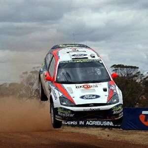 World Rally Championship: Colin McRae / Derek Ringer Ford Focus RS WRC 02, flies over the cattle grid at high speed and lands heavily on the