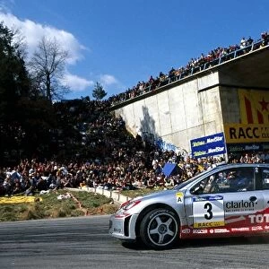 World Rally Championship: Gilles Panizzi slides his Peugeot 206 WRC around a hairpin on the way to victory