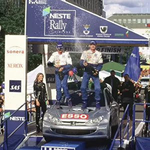 WRC Neste Rally of Finland 2000 17th - 20th August 2000. Rd 9/13. Rally winner Marcus Gronholm, Peugeot, podium. Photo:McKlein/LAT Ref 35mm A16