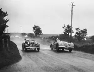 Allmyraces Gallery: 1950 Tourist Trophy: Stirling Moss, 1st position, passes T. Flack, 23rd position, action