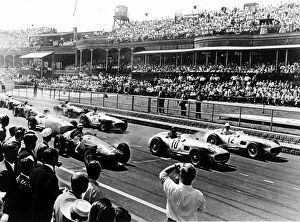Crowd Collection: 1955 British Grand Prix: Stirling Moss, Juan Manuel Fangio and Jean Behra lead Karl Kling