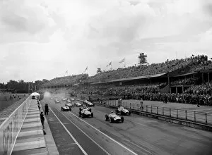 1950s F1 Gallery: 1957 British Grand Prix: Jean Behra, retired, leads at the start, with Stirling Moss