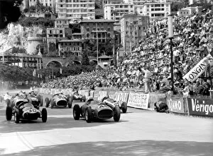 1959 Monaco Grand Prix: Stirling Moss, #30 Cooper T51-Climax, retired, and Jean Behra, #46 Ferrari Dino 246, retired