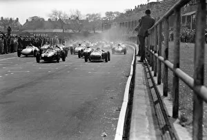 Images Dated 8th April 2011: 1960 Aintree 200: Stirling Moss, 1st position, leads Jack Brabham, retired