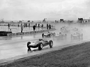 Images Dated 31st March 2011: 1961 BRDC International Trophy: Jack Brabham, 2nd position, leads Bruce McLaren, retired