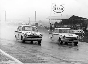 BTCC Collection: 1964 British Saloon Car Championship: Jim Clark, Lotus Cortina #70 leads another Lotus Cortina