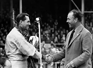 1964 International Trophy: Max Aitken congratulates Jack Brabham. Brabham BT7, 1st position, podium