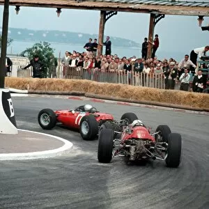Station Gallery: 1965 Monaco Grand Prix: Lorenzo Bandini leads John Surtees in station hairpin