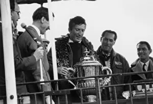 1966 Motor Show 200: Jochen Rindt, 1st position, lifts the winners trophy with Jack Brabham, 2nd position
