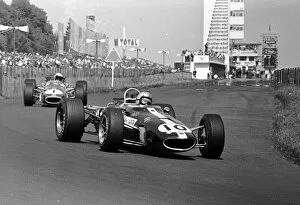Images Dated 19th May 2014: 1967 GERMAN GP - NURBURGRING: Bruce McLaren leads World Champion Jack Brabham at the Nurburgring